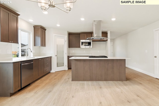 kitchen featuring a kitchen island, appliances with stainless steel finishes, sink, and island range hood