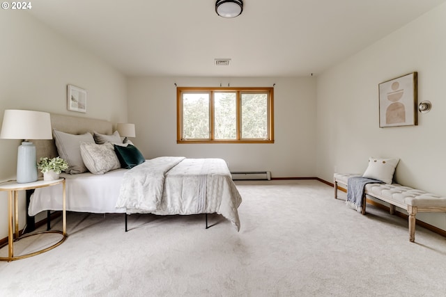 bedroom with light colored carpet and a baseboard heating unit