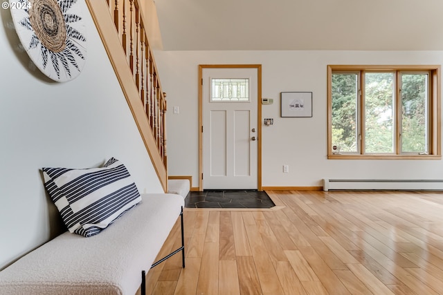 foyer featuring wood-type flooring and baseboard heating