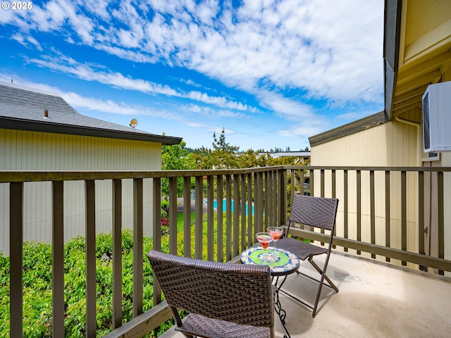 balcony featuring view of pool