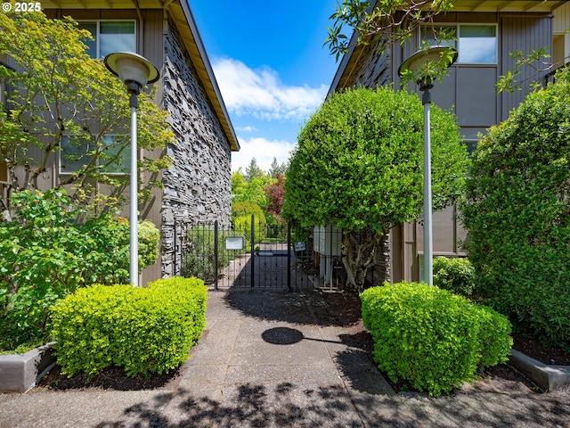 view of community featuring a gate and fence