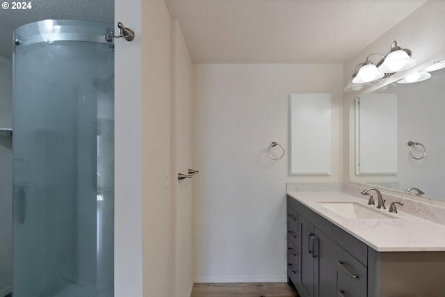 bathroom featuring wood-type flooring and a shower with door