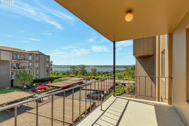 balcony featuring a water view