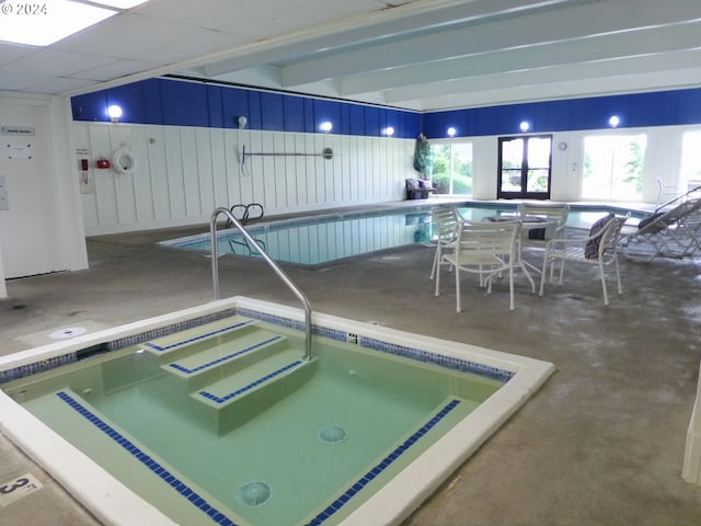 gym featuring a drop ceiling