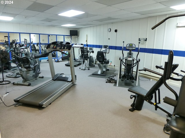 exercise room featuring a paneled ceiling