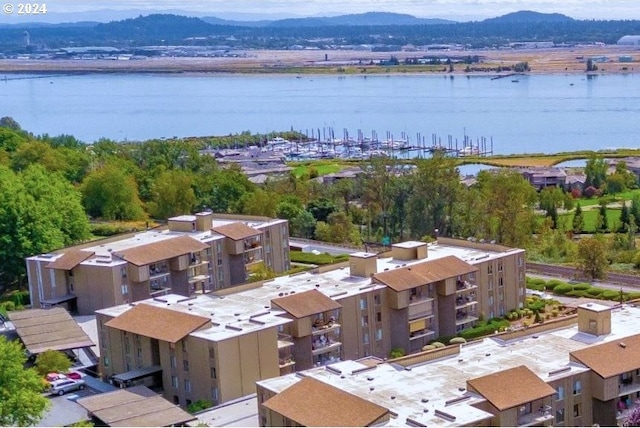 bird's eye view with a water and mountain view