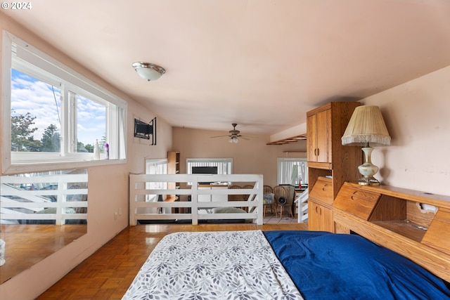 interior space with light parquet flooring and ceiling fan