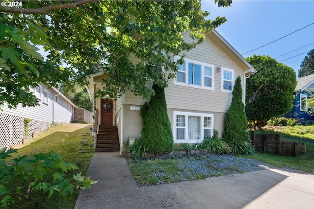 view of front of property featuring fence