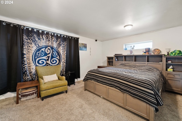 bedroom featuring light carpet