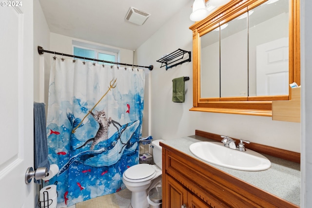 bathroom featuring toilet, visible vents, a shower with shower curtain, and vanity