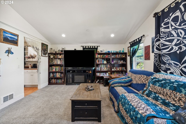 carpeted living room featuring recessed lighting, visible vents, and vaulted ceiling