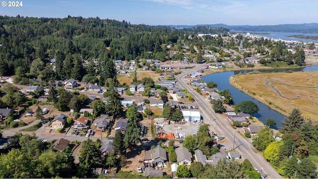 birds eye view of property featuring a water view and a residential view