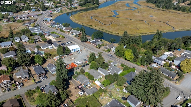 bird's eye view featuring a residential view and a water view