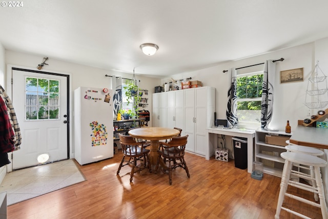 dining area with light wood-style flooring