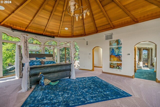 carpeted bedroom featuring beam ceiling, wooden ceiling, and high vaulted ceiling