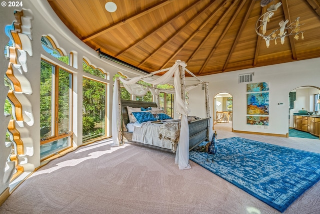 unfurnished bedroom featuring beam ceiling, carpet floors, wood ceiling, and high vaulted ceiling