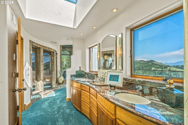 bathroom featuring vanity and a mountain view