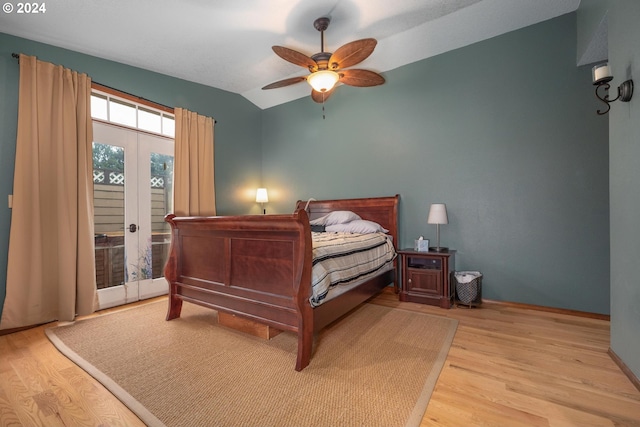 bedroom featuring french doors, access to outside, vaulted ceiling, ceiling fan, and light hardwood / wood-style floors