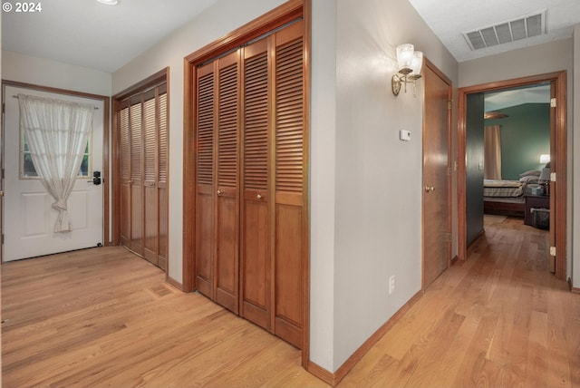 hallway featuring light wood-type flooring