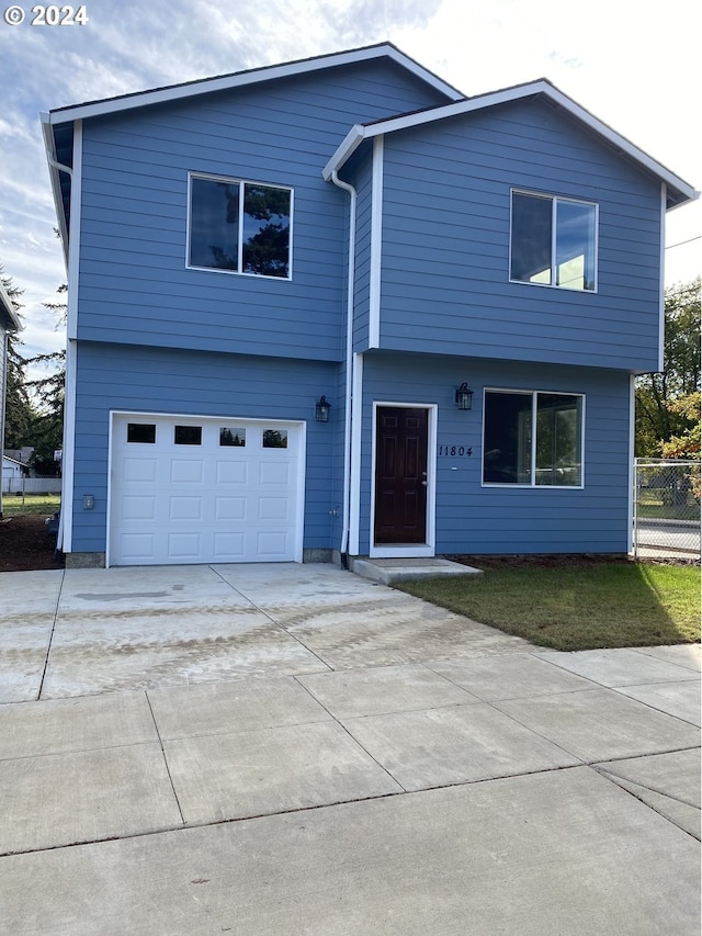 11804 SE Schiller St, Portland, OR 97266 - view of front of property with a garage, driveway, and fence