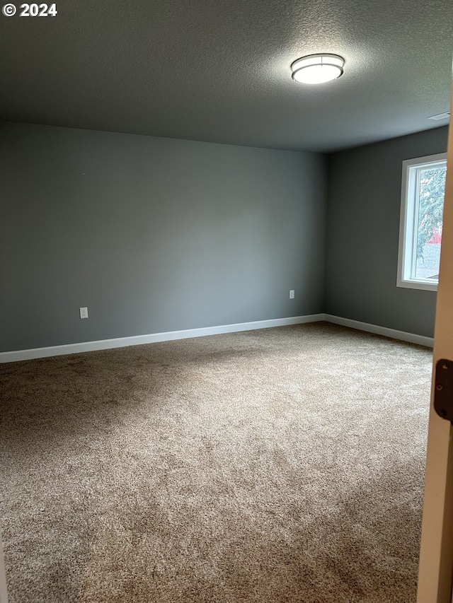 11804 SE Schiller St, Portland, OR 97266 - spare room featuring carpet, a textured ceiling, and baseboards