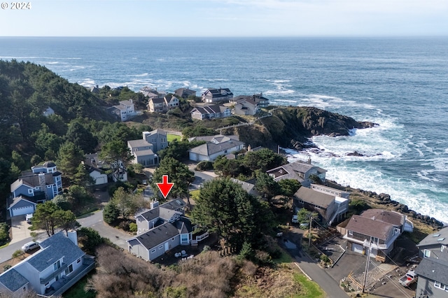 birds eye view of property with a residential view and a water view