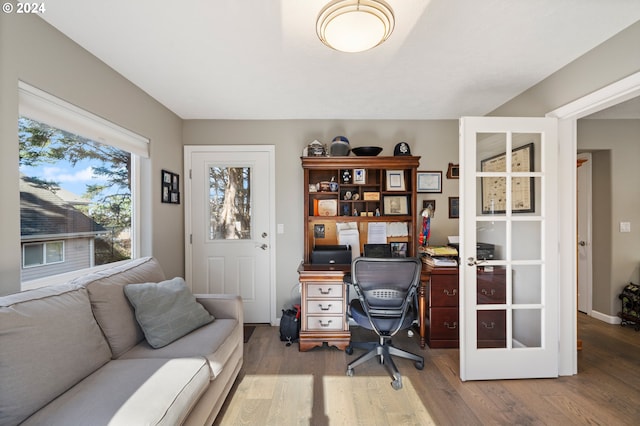 home office with wood finished floors