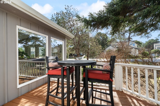 deck with outdoor dining area