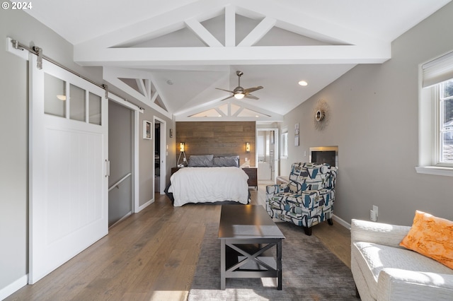 bedroom featuring vaulted ceiling with beams, baseboards, a barn door, recessed lighting, and dark wood-style flooring