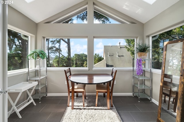 sunroom / solarium featuring plenty of natural light and vaulted ceiling