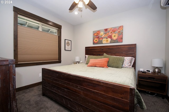 bedroom with ceiling fan, dark carpet, and an AC wall unit