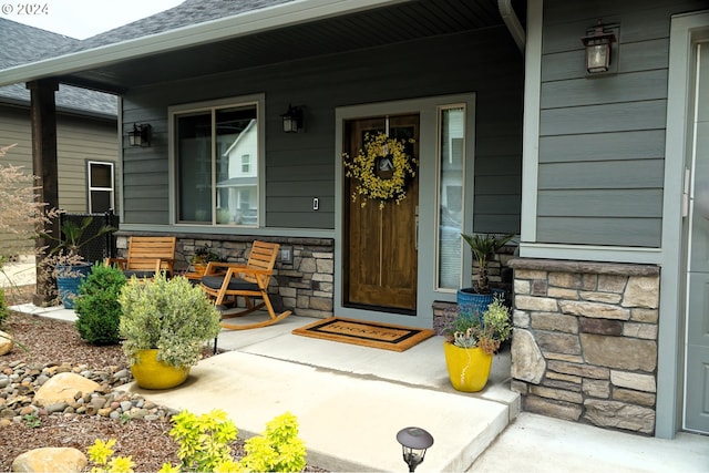 doorway to property with covered porch