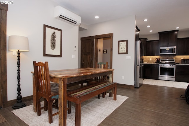 dining room featuring light hardwood / wood-style floors and a wall mounted AC