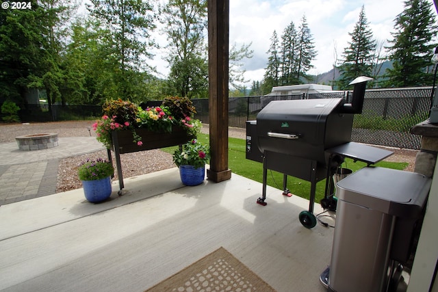 view of patio with a fire pit