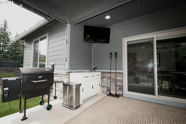 view of patio featuring a grill