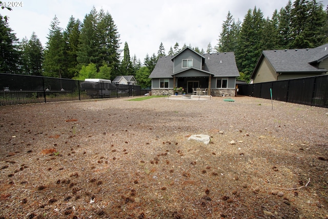 rear view of property featuring a patio