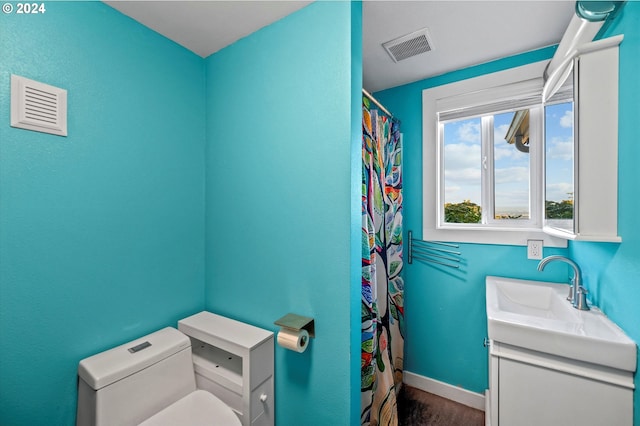 bathroom with vanity and toilet