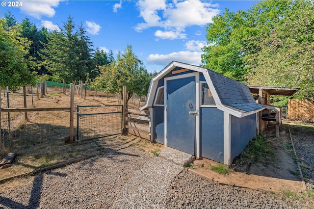 view of outbuilding with a rural view