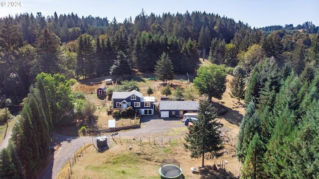 birds eye view of property with a rural view