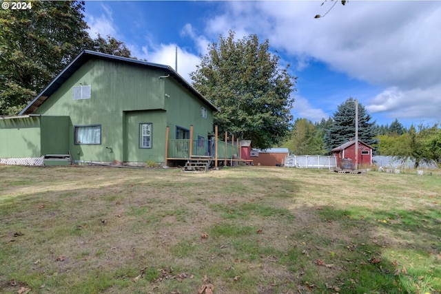 view of yard featuring a wooden deck