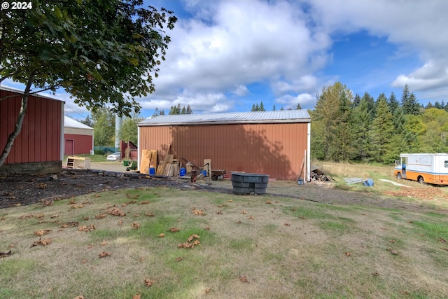 view of outbuilding with a lawn