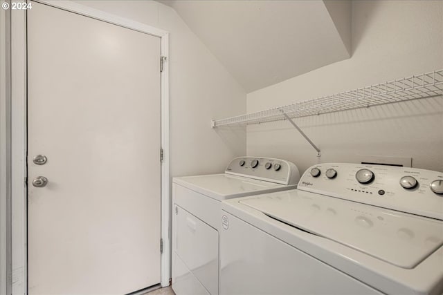 laundry room with washing machine and clothes dryer