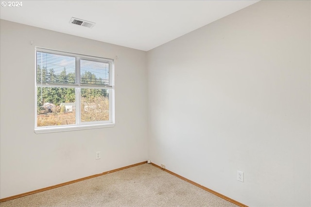 empty room with light colored carpet