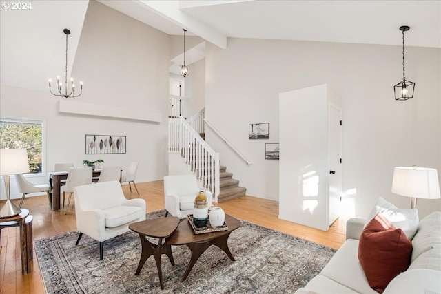 living room with beam ceiling, hardwood / wood-style flooring, high vaulted ceiling, and a notable chandelier