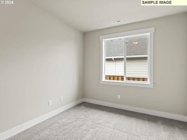 unfurnished room with carpet floors