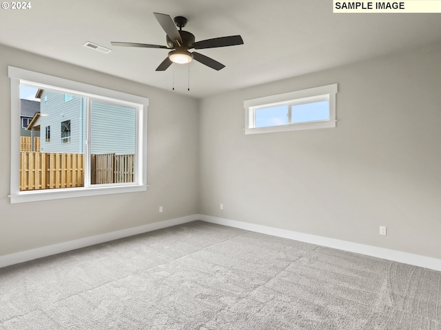 carpeted empty room with ceiling fan