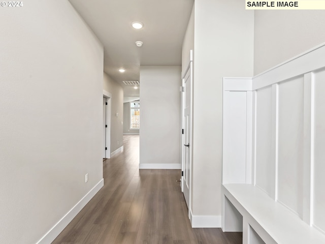 hallway with dark hardwood / wood-style floors