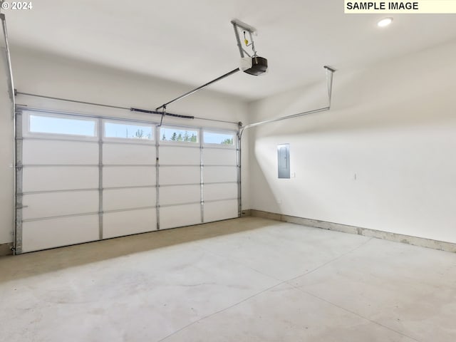 garage featuring electric panel and a garage door opener