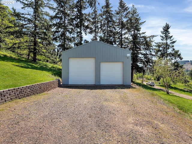 garage featuring a lawn