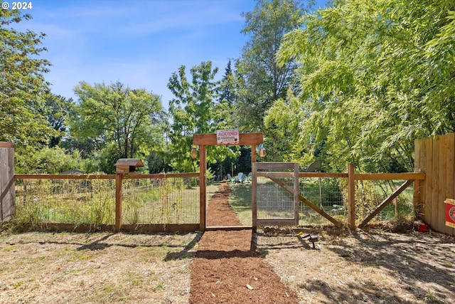 exterior space with fence and a gate